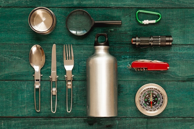 Top view traveling kit on wooden board