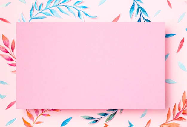 Photo top view tropical leaves on pink background