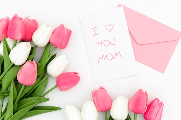 top view of tulips bouquet with envelope