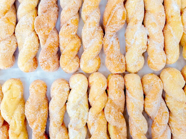 Top view of twist doughnuts with sugar