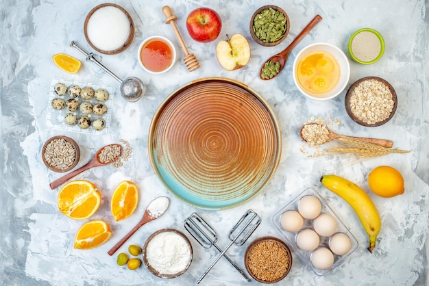 Top view of two-toned plate and ingredients for the healthy foods selection on ice background