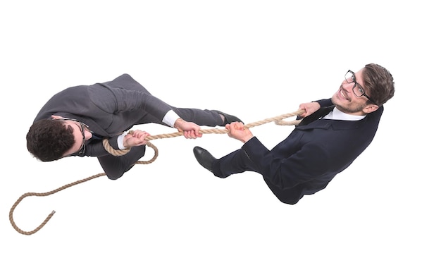 Photo top view two young businessmen pulling the rope