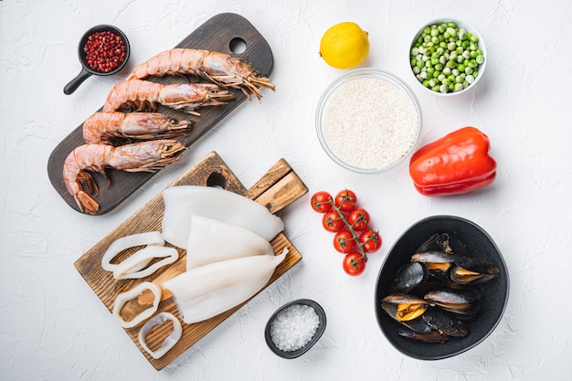 Top view on typical seafood paella ingredients