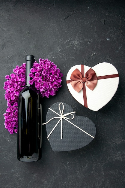 top view valentines day present with flowers and bottle of wine on dark background love feeling couple gift colors alcohol marriage