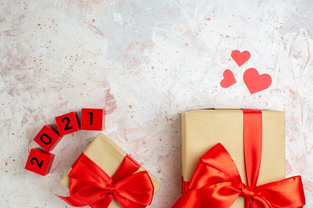 top view valentines day presents with red bow on light background lover love couple marriage heart color feeling