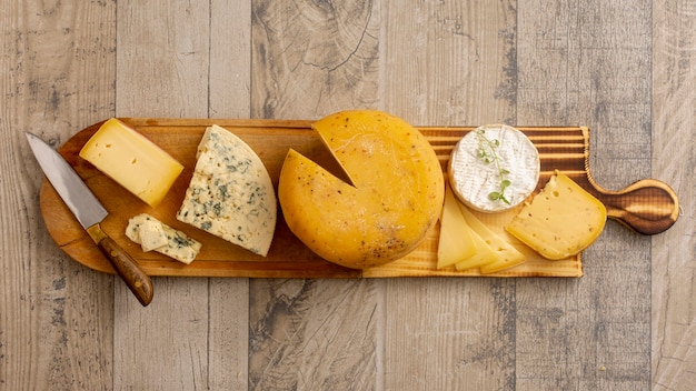 Top view various cheeses on a table