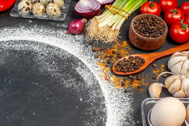 Top view of various fresh foods with flour around