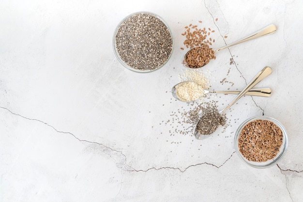 Top view various seeds and spoons