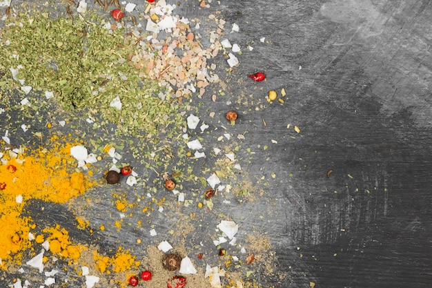 Top view of various spices on concrete