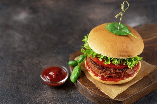 Top view of vegan burger on dark rustic brown 