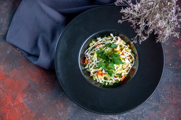 top view vegetable salad decorated inside plate dark surface meal colour horizontal food diet health lunch