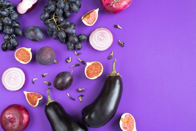 Top view of vegetables and fruits on the violet