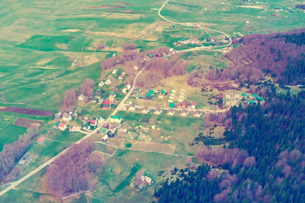 Top view of a village near the forest