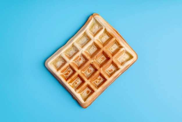 Top view of waffle on blue background