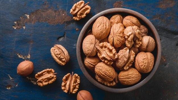 Top view of walnuts in a bowl on rustic