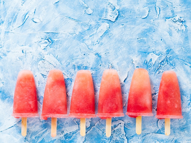 Top view of watermelon popsicles with copy space