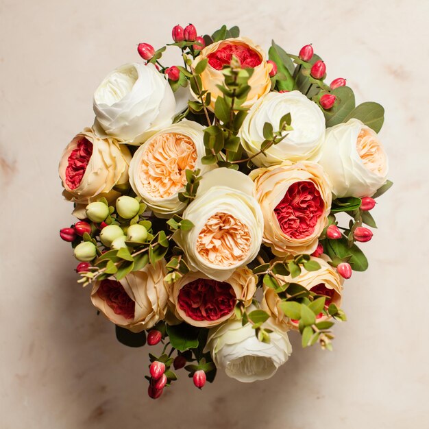 Top view of wedding bouquet on the pink marble table