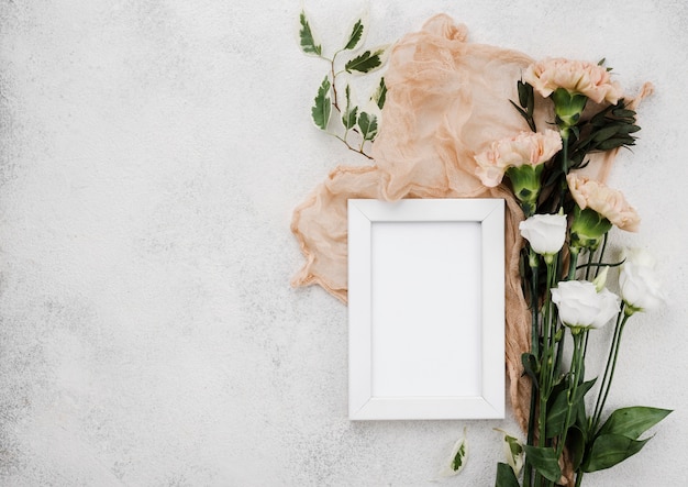 Top view wedding flowers and frame with copy space