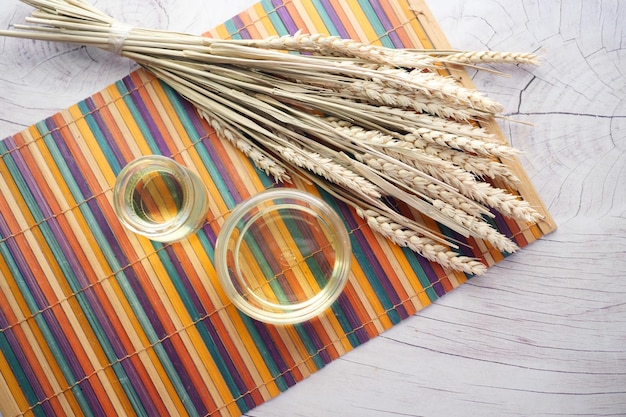 Top view of wheat cooking oil bottle on table