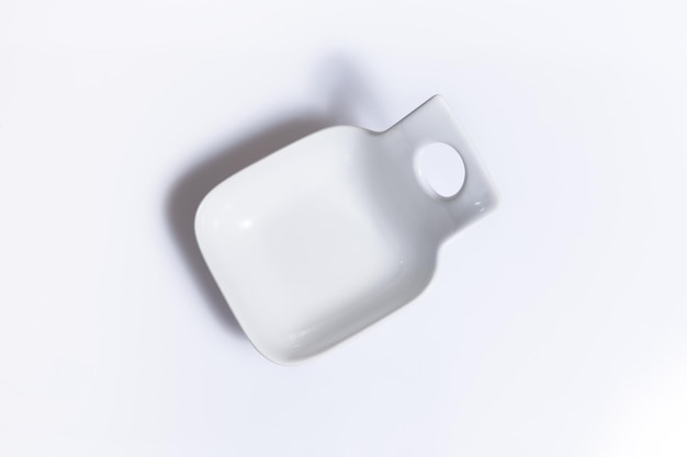 Top view of white food container on white background