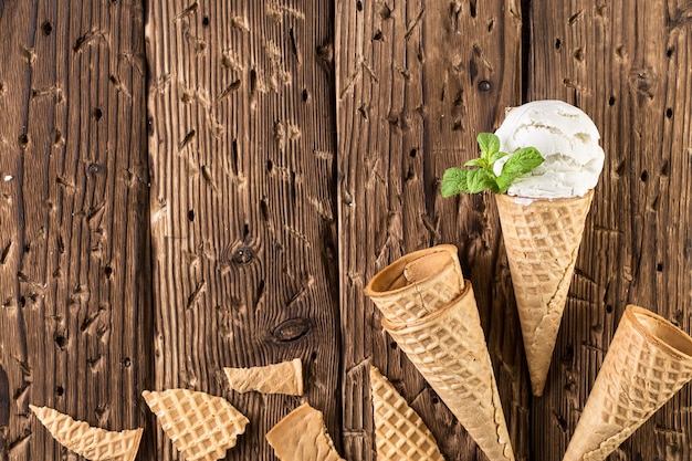 Top view white ice cream in waffle cone 