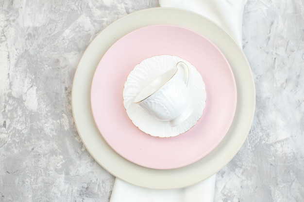 top view white plate with pink plate and cup on light surface kitchen glass food meal ladies femininity horizontal