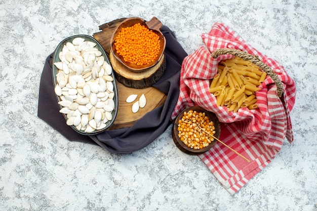 top view white seeds with orange lentils on white background nut snack pasta dough color photo