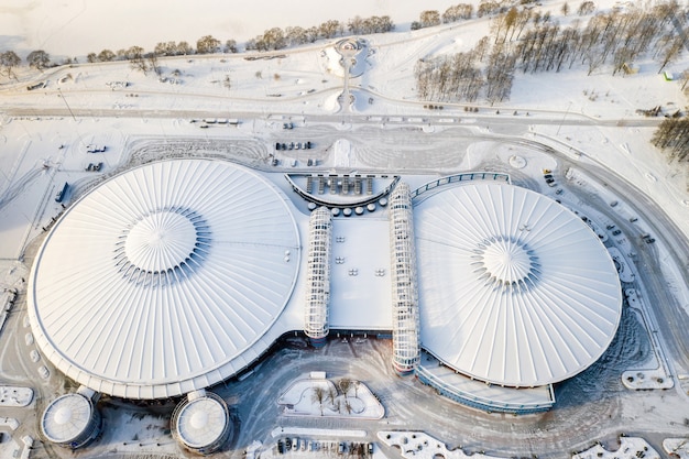 Top view in winter of a modern sports complex with parking in Minsk Belarus