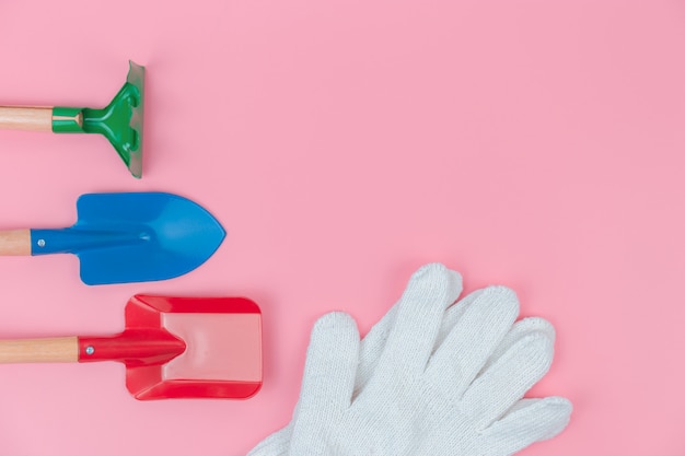 Top view with  of Gardener tools overhead on pink pastel background, Flat lay 