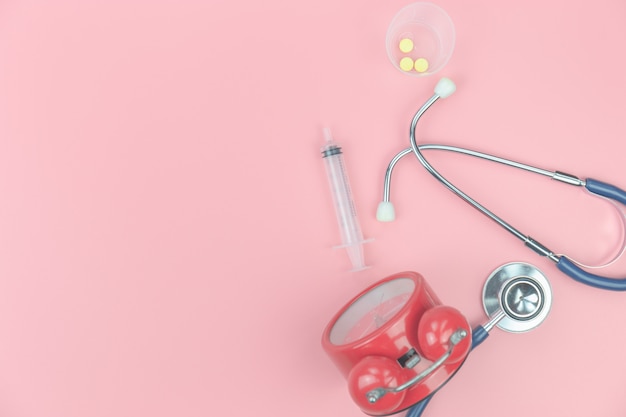 Top view with  of Stethoscope on the pink background, Medical  Healthy 