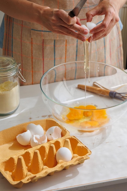 Top view of woman beating eggs for an omelette or pie cook delicious and healthy food