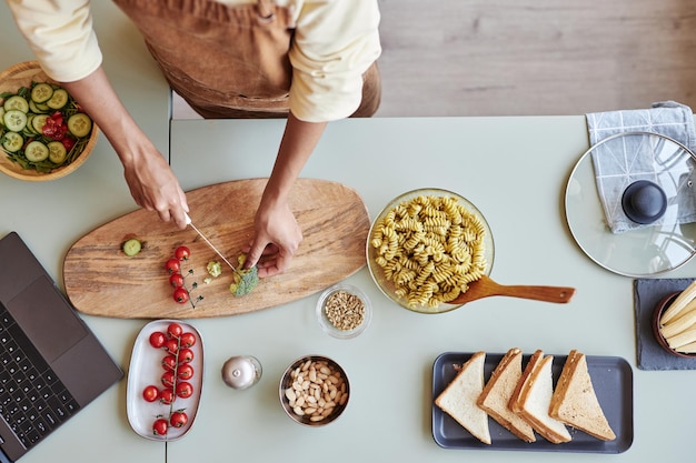 Top view woman cooking pasta