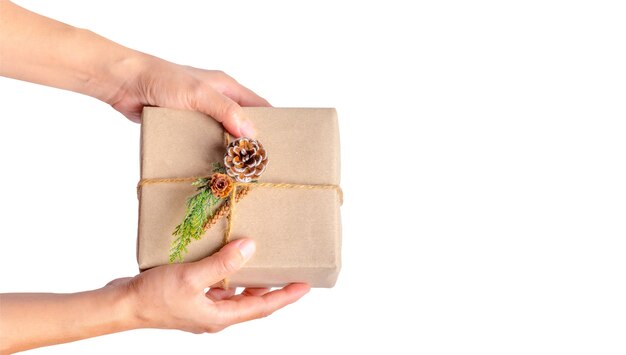 top view of woman hand holding Christmas present box isolated on white background