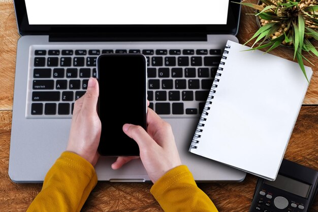 Top view of woman hand using smartphone mobile payments online shopping