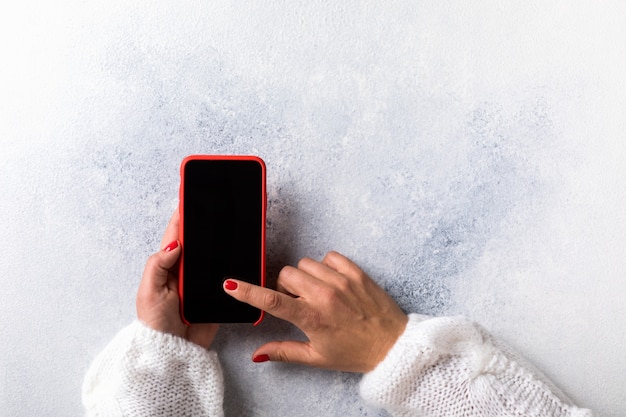 Top view of woman using smartphone