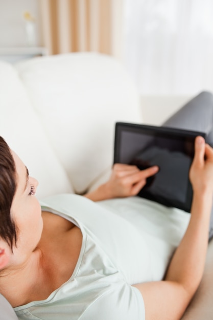 Top view of a woman using a tablet computer