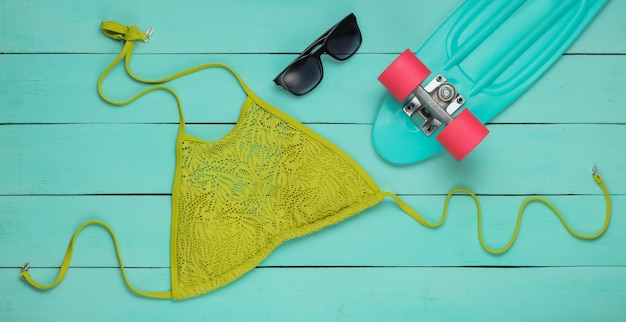 Top view on women swimwear and beach accessories