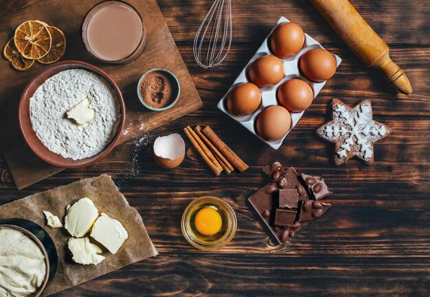 Top view on wood background with ingredients for making dough