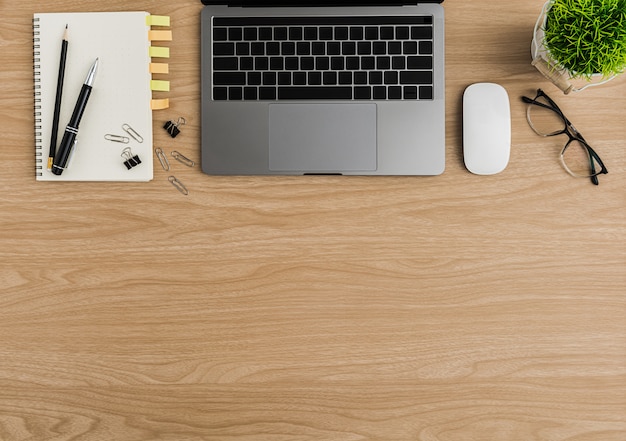 Top view wood office desk table. flat lay workspace