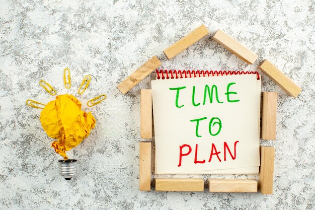 top view wooden blocks house shape time to plan written on paper creative idea icon concept on white grey background