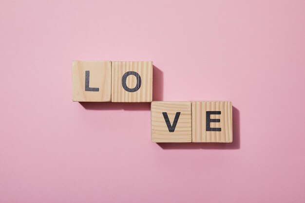 Photo top view wooden cubes letters