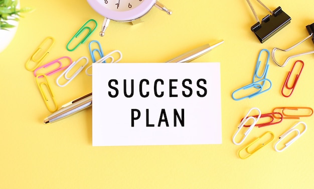 Top view of workplace with success plan message