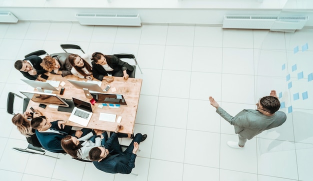 Top view. young businessman standing in the middle of a spacious office. photo with copy space