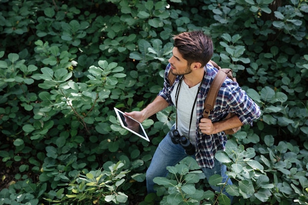 Top view of young man in forest