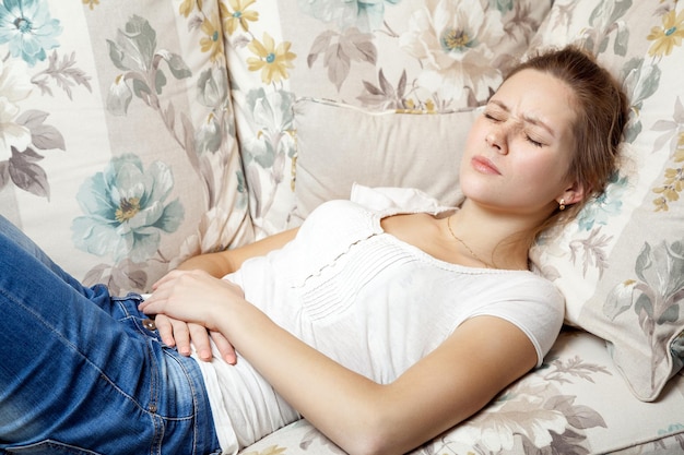 Top view of young sick woman in bed