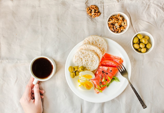 Top view Of Young Woman Having A Lunch Break. High protein and low carbohydrate meal. Paleo diet concept.Copy space.