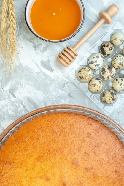 top view yummy baked pie with eggs and flour on white background sugar bake dough pie dessert cake sweet biscuit