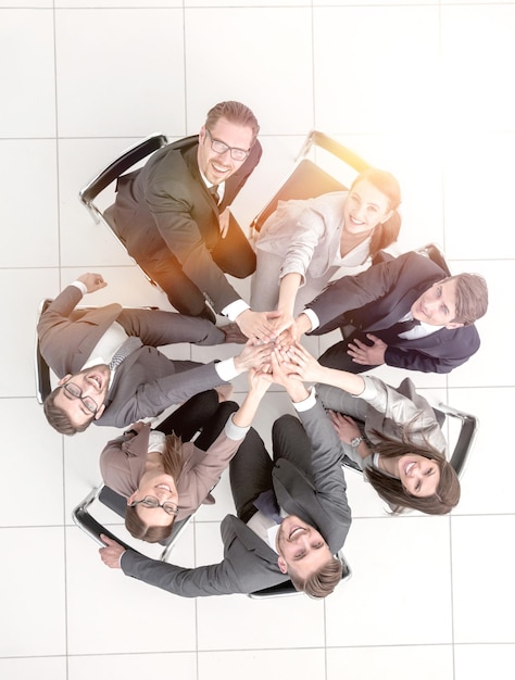 Top viewa group of business people sitting in a circle