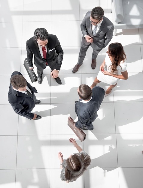 Top viewa group of business people standing on a marble floor