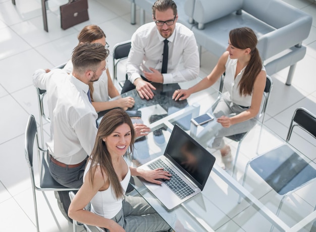 Top viewyoung business woman at a working meeting in the officebusiness concept